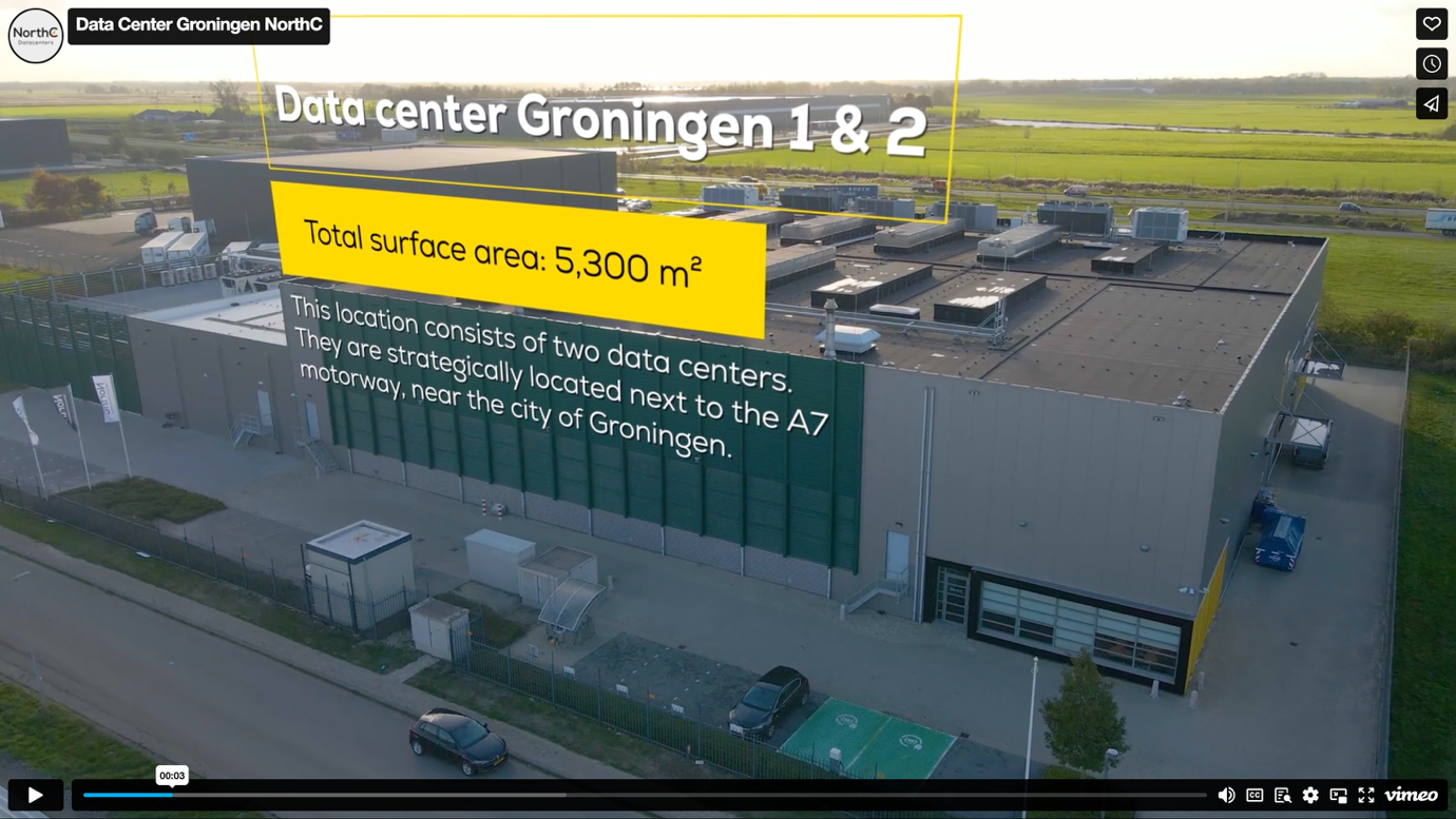 A large building with a green wall AI-generated content may be incorrect.